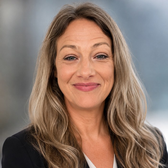 Professional headshot of Emma Dennis